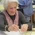 Elderly woman painting