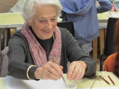 Elderly woman painting