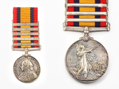 Medals on a red, blue and yellow stripe ribbon with 5 metal bars. Left: woman facing left wearing a crown. Right: woman wearing a helmet looking at a group of men. Right hand, with wreath, out stretched towards the letter R in SOUTH AFRICA.