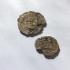 Two Medieval cloth seals from Guildford which were attached to cloth after being checked for quality