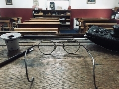 Victorian teacher's spectacles on desk