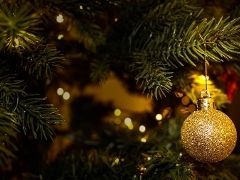 Christmas tree with golden hanging bauble Christmas tree with golden hanging bauble