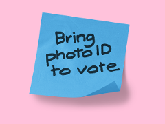 A post it note with caption of Bring photo ID to vote