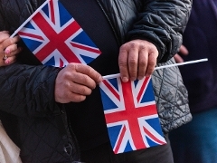 Hand waving union flag Hand holding a union flag