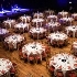 many dining tables prepared for a dinner in the main auditorium