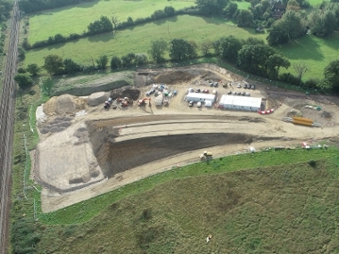View from above of the south side of the building site. A mound of earth has been constructed that will form part of the bridge.