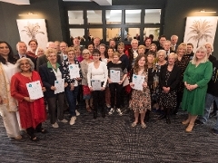 Mayor awards last years winners group of people with awards at Mayor's Awards