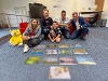 Judges in front of blurred winning entries