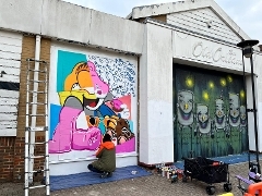 Street artwork being painted onto the Old Orleans building in Guildford